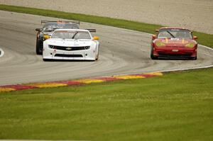 Tim Gray's Chevy Camaro, Ernie Francis, Jr.'s Chevy Camaro and Clint Sawinski's Porsche GT3 Cup