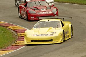 Doug Peterson's Chevy Corvette, Amy Ruman's Chevy Corvette and Cliff Ebben's Ford Mustang on the first lap