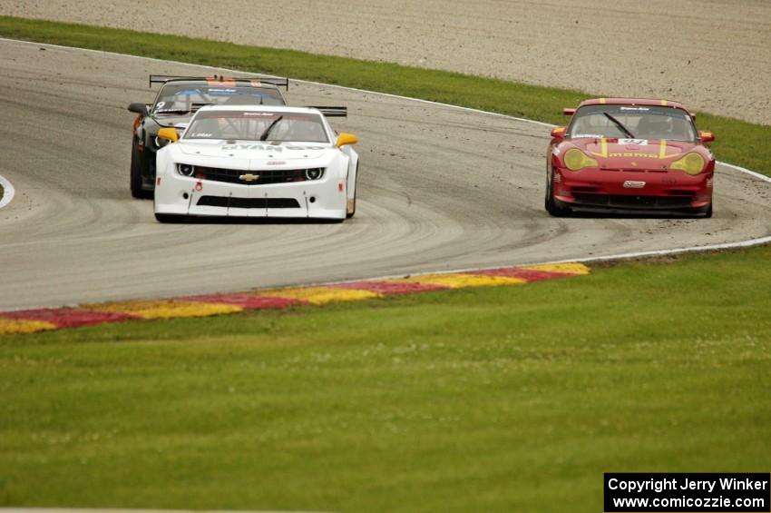 Tim Gray's Chevy Camaro, Ernie Francis, Jr.'s Chevy Camaro and Clint Sawinski's Porsche GT3 Cup