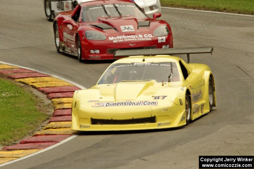 Doug Peterson's Chevy Corvette, Amy Ruman's Chevy Corvette and Cliff Ebben's Ford Mustang on the first lap