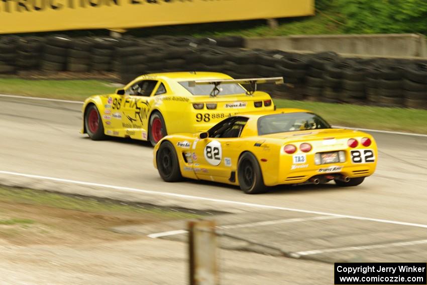 Bob Stretch's Chevy Camaro passes Norman Betts' Chevy Corvette