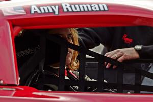 Amy Ruman sits in her Chevy Corvette