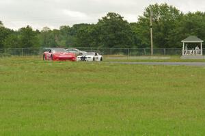 Jim McAleese's Chevy Corvette and Joe Ebben's Ford Mustang at turn 4.