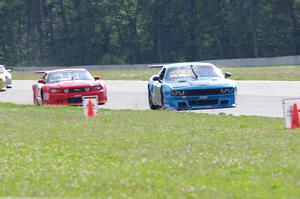 Cameron Lawrence's Dodge Challenger holds off Ron Keith's Ford Mustang