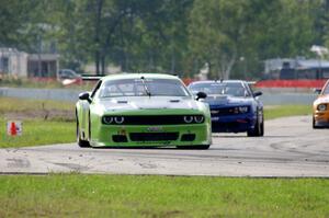 Tommy Kendall's Dodge Challenger and Fernando Seferlis' Chevy Camaro