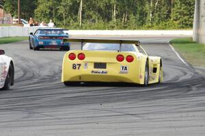 Doug Peterson's Chevy Corvette chases Cameron Lawrence's Dodge Challenger