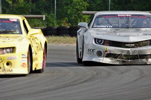 Bob Stretch's and Adam Andretti's Chevy Camaros battle late in the race.