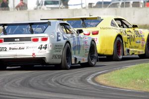 Bob Stretch's and Adam Andretti's Chevy Camaros battle late in the race.