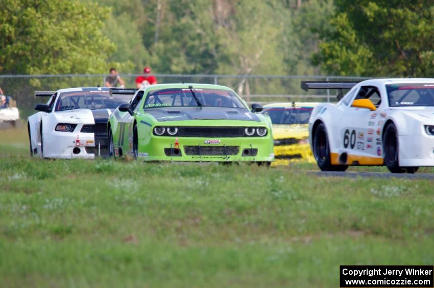 Tim Gray's Chevy Camaro, Tommy Kendall's Dodge Challenger and Joe Ebben's Ford Mustang