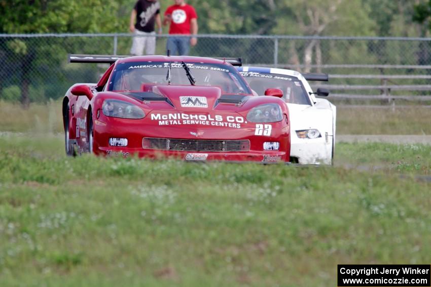 Amy Ruman's Chevy Corvette is chased by Cliff Ebben's Ford Mustang