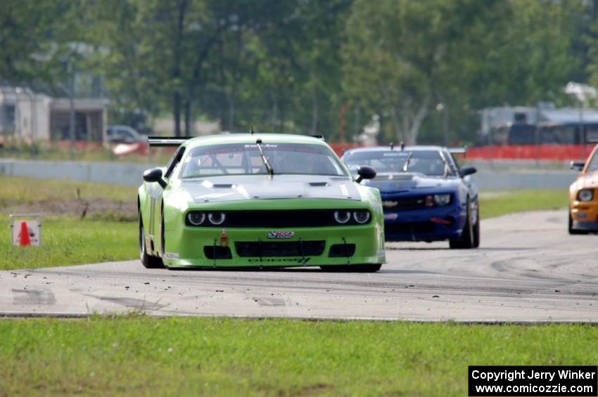 Tommy Kendall's Dodge Challenger and Fernando Seferlis' Chevy Camaro