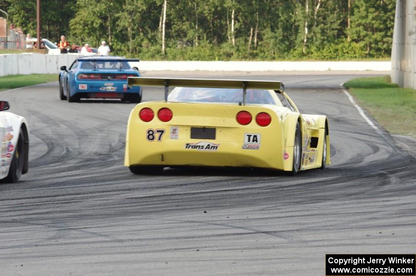 Doug Peterson's Chevy Corvette chases Cameron Lawrence's Dodge Challenger