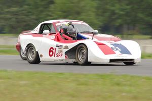 Patrick Rounds's Spec Racer Ford passes Dan Schaut's STL Mazda Miata