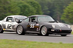 Phil Magney's ITE-2 Porsche 993 passes Ray Yergler's STL Mazda Miata