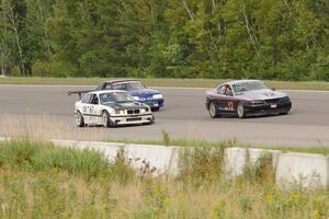 Tom Fuehrer's SPO Ford Mustang, Rick Iverson's ITE-1 BMW M3 and Damon Bosell's SPO Ford Mustang after the drop of the green.