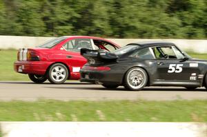 Phil Magney's ITE-1 Porsche 993 passes John Glowaski's ITA Dodge Neon ACR