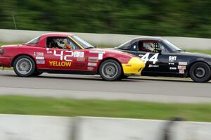 Paul Gilbert's Spec Miata Mazda Miata nips Greg Youngdahl's ITA Mazda Miata