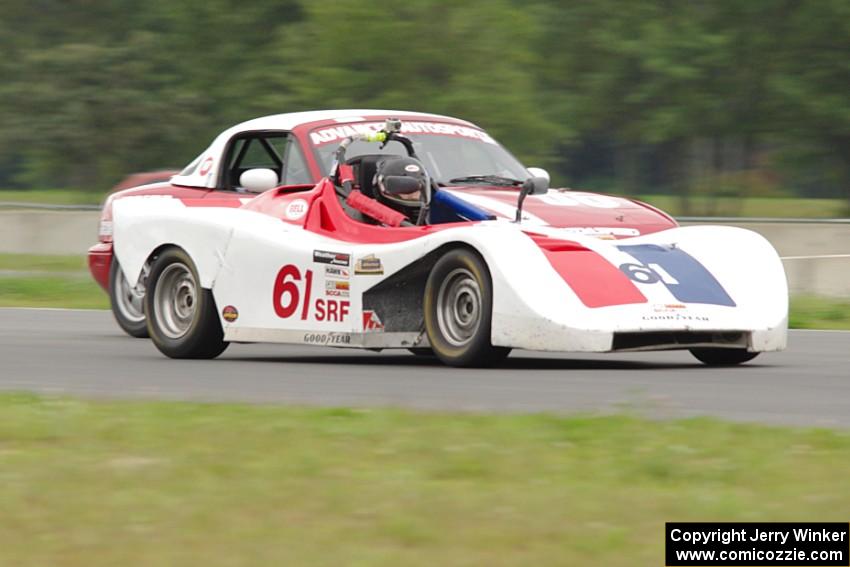 Patrick Rounds's Spec Racer Ford passes Dan Schaut's STL Mazda Miata