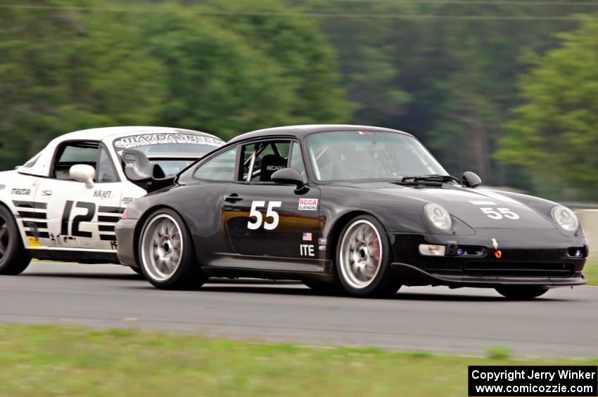 Phil Magney's ITE-2 Porsche 993 passes Ray Yergler's STL Mazda Miata