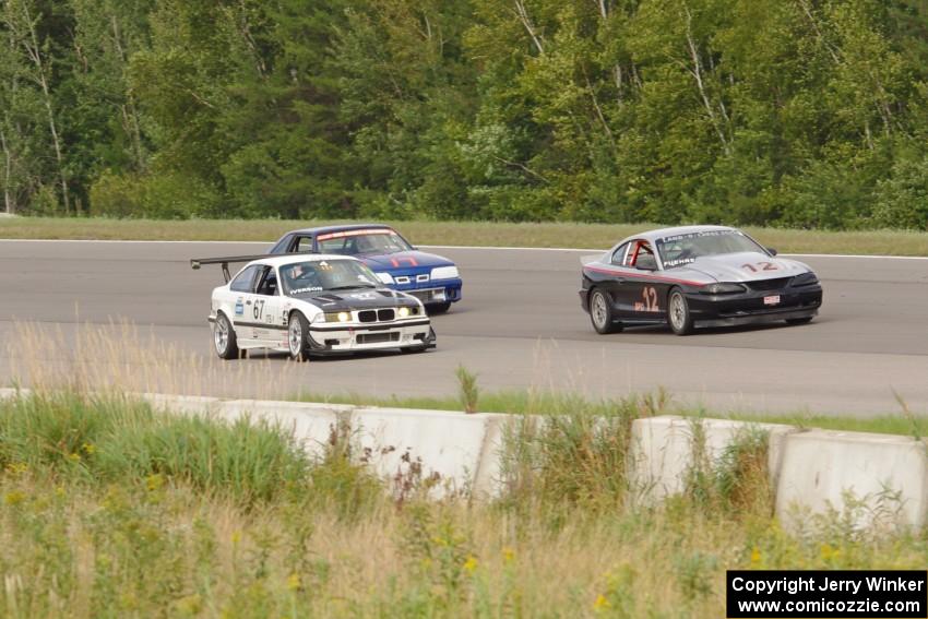 Tom Fuehrer's SPO Ford Mustang, Rick Iverson's ITE-1 BMW M3 and Damon Bosell's SPO Ford Mustang after the drop of the green.