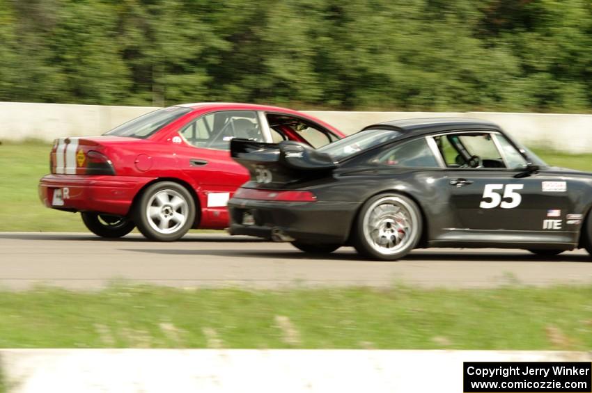 Phil Magney's ITE-1 Porsche 993 passes John Glowaski's ITA Dodge Neon ACR