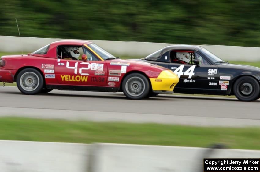 Paul Gilbert's Spec Miata Mazda Miata nips Greg Youngdahl's ITA Mazda Miata