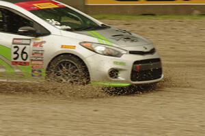 Jason Wolfe's Kia Forte Koup goes straight off at turn 12.