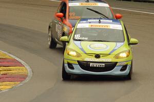 Michael Ashby's Mazda 2 and Austin Snader's Fiat 500