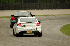 Jon Miller's Honda Civic Si chases Bryan Heitkotter's Nissan Altima Coupe