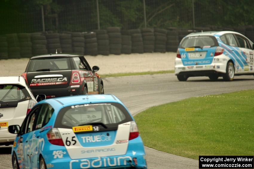 P.J. Groenke's Honda Fit leads Glenn Nixon's MINI Cooper, Ryan Reed's Honda Fix and Paul Holton's Honda Fix