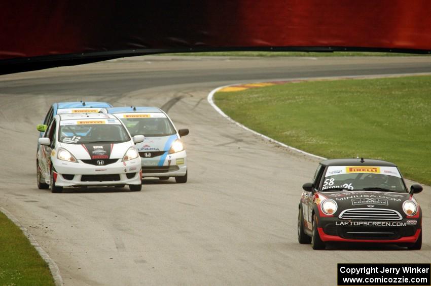 Glenn Nixon's MINI Cooper followed by Ryan Reed's Honda Fix, P.J. Groenke's Honda Fit and