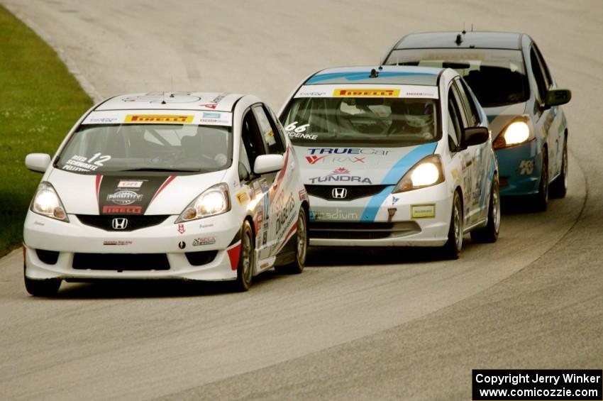 Ryan Reed's Honda Fix leads P.J. Groenke's Honda Fit and Paul Holton's Honda Fix