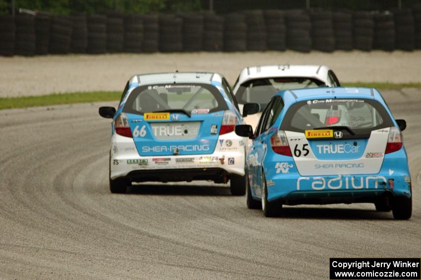 Ryan Reed's Honda Fix leads P.J. Groenke's Honda Fit and Paul Holton's Honda Fix