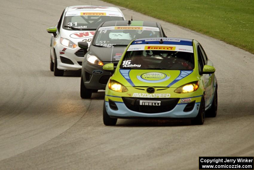 Michael Ashby's Mazda 2, Nate Stacy's Ford Fiesta and Chris Capaldi's Ford Fiesta