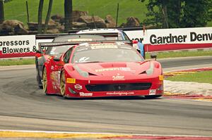 Anthony Lazzaro's Ferrari 458 Italia GT3 followed by Mike Skeen's and Andrew Palmer's Audi R8 Ultras