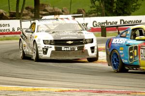 Andy Lee's Chevy Camaro chases Jack Roush, Jr.'s Ford Mustang Boss 302S