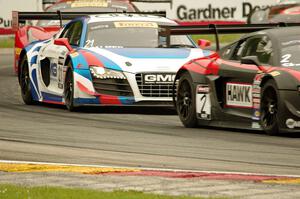 Mike Skeen's and Andrew Palmer's Audi R8 Ultra followed by Nick Mancuso's Ferrari 458 Italia GT3