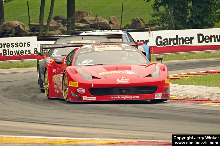 Anthony Lazzaro's Ferrari 458 Italia GT3 followed by Mike Skeen's and Andrew Palmer's Audi R8 Ultras