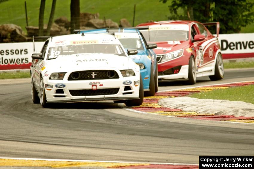 Dean Martin's Ford Mustang Boss 302S, Tony Buffomante's Ford Mustang Boss 302S and Mark Wilkins' Kia Optima