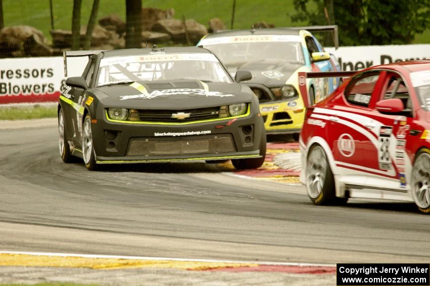Mark Wilkins' Kia Optima, Lawson Aschenbach's Chevy Camaro and Jack Roush, Jr.'s Ford Mustang Boss 302S