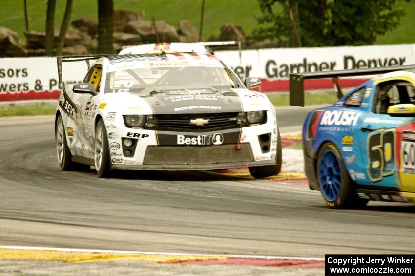 Andy Lee's Chevy Camaro chases Jack Roush, Jr.'s Ford Mustang Boss 302S