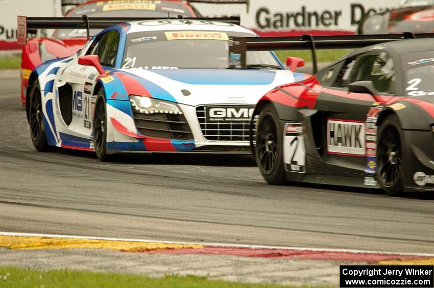 Mike Skeen's and Andrew Palmer's Audi R8 Ultra followed by Nick Mancuso's Ferrari 458 Italia GT3