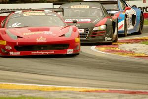 Anthony Lazzaro's Ferrari 458 Italia GT3, and Mike Skeen's and Andrew Palmer's Audi R8 Ultras