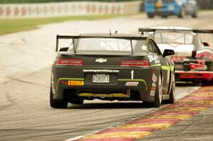 Lawson Aschenbach's Chevy Camaro chases Jack Baldwin's Porsche Cayman S