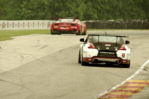 Brian Kleeman's Nissan 370Z follows Nick Mancuso's Ferrari 458 Italia GT3