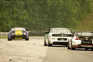 Mark Klenin's Aston Martin Vantage GT4 ahead of Erik Davis' Ford Mustang Boss 302S and Brian Kleeman's Nissan 370Z