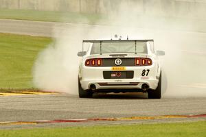 Chris Outzen's Ford Mustang Boss 302S comes to a stop after losing the engine on the first lap.