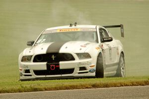 Chris Outzen's Ford Mustang Boss 302S comes to a stop after losing the engine on the first lap.