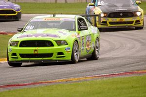 Brad Adams' Ford Mustang Boss 302S, Jack Roush, Jr.'s Ford Mustang Boss 302S and Mark Klenin's Aston Martin Vantage GT4