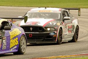 Alec Udell's Ford Mustang Boss 302S chases Mark Klenin's Aston Martin Vantage GT4